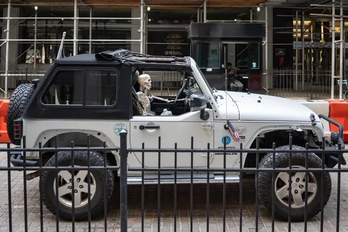 A photo of a skeleton in a Jeep in Lower Manhattan
